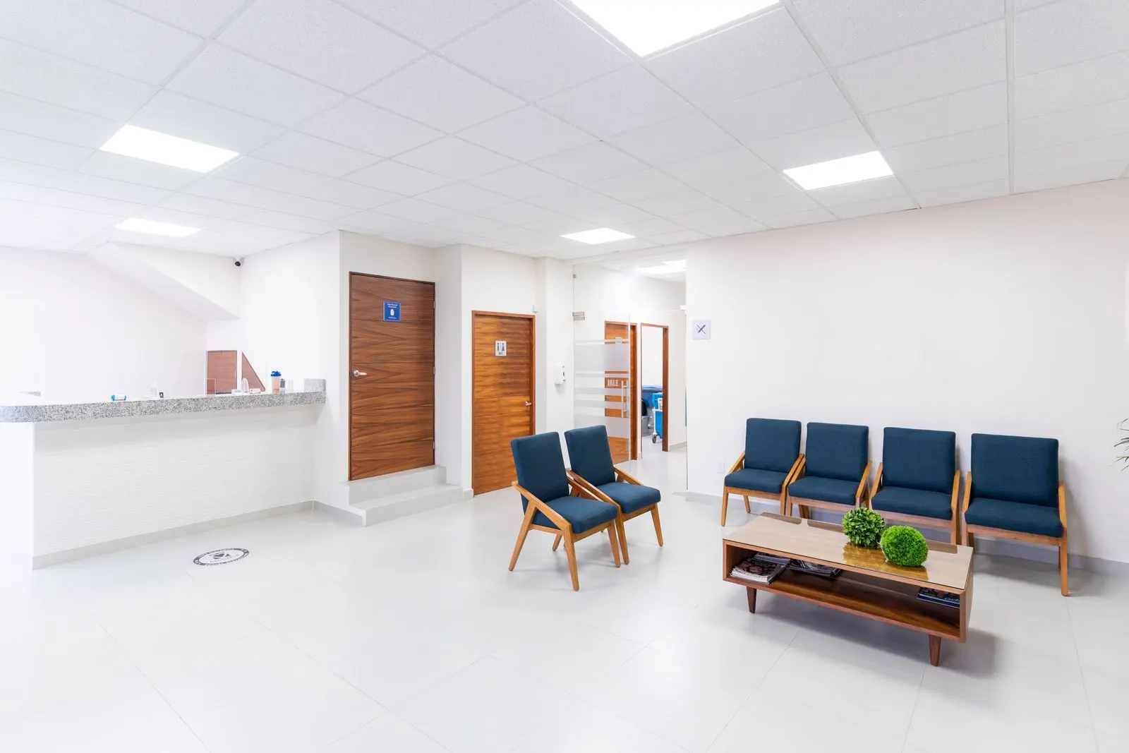 A clinic reception room furnished more like a living room than a waiting area.