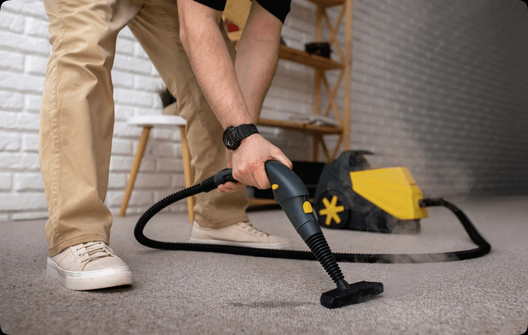 A steam cleaner on a beige carpet.