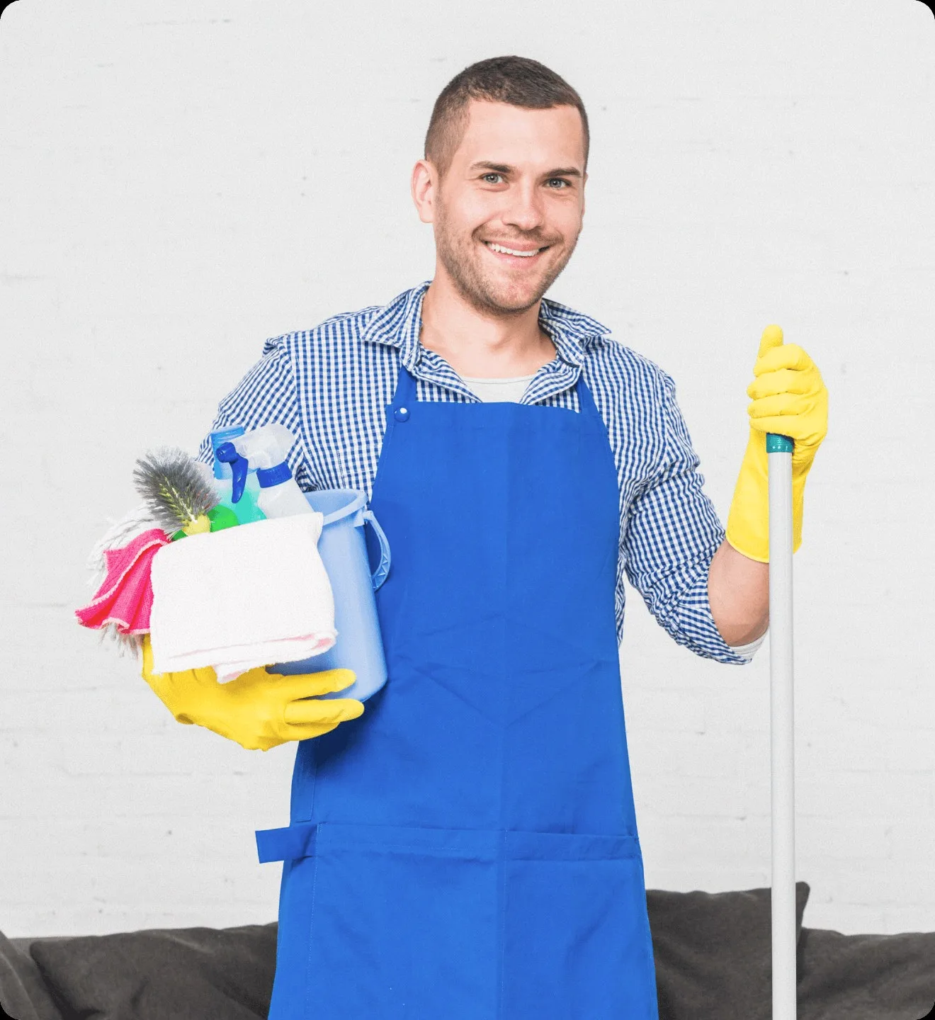 A cleaner in a blue apron with a mop and a caddy.