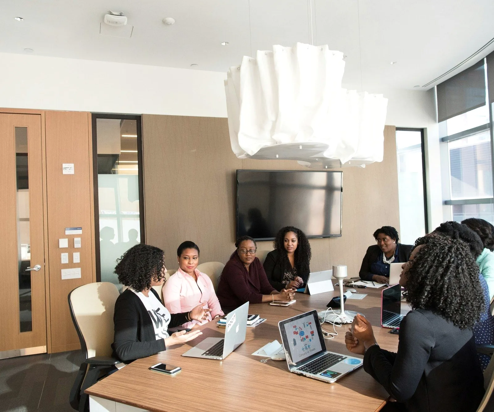 A team meeting in a bright boardroom.
