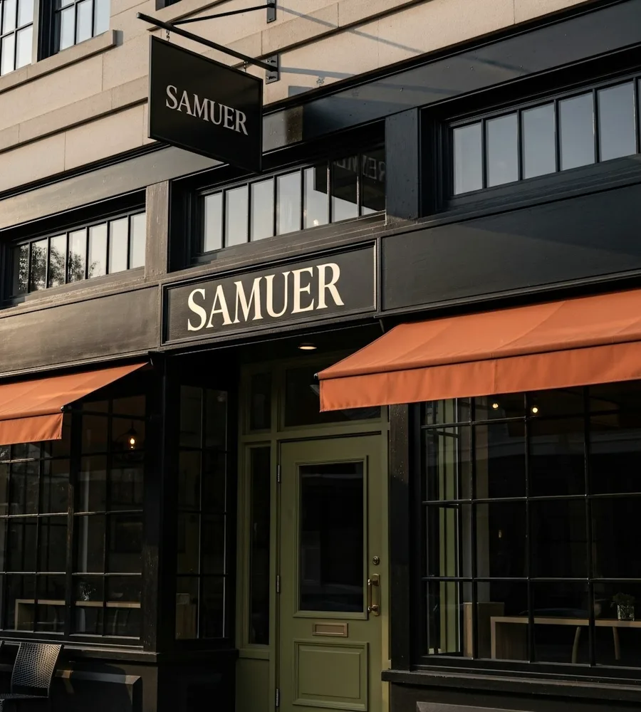 A shopfront with an orange awning.