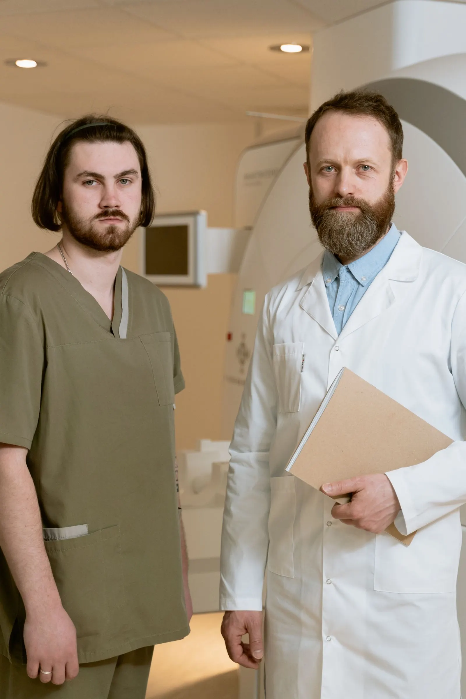 Two clinicians in a treatment room, talking rather than working.