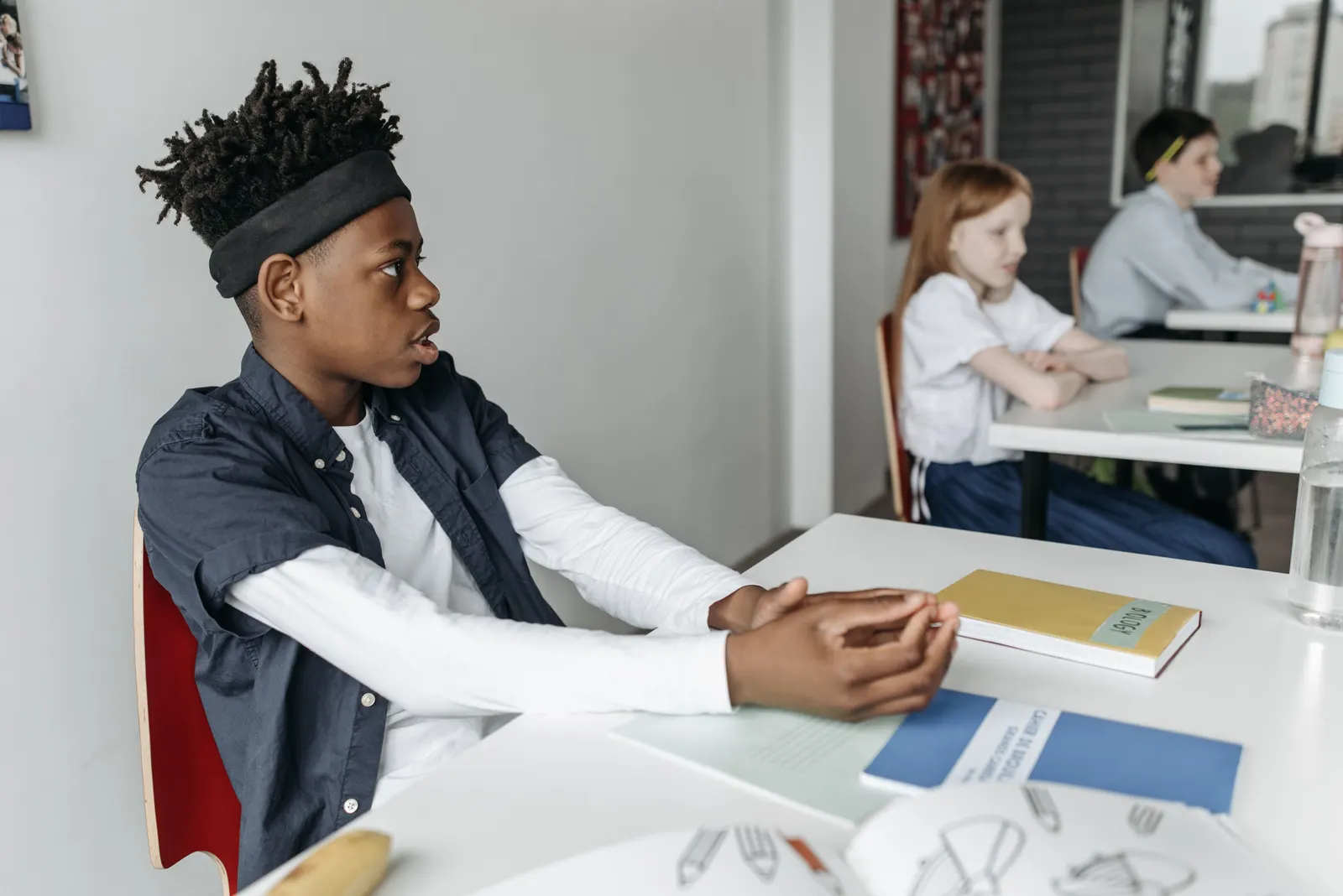 A classroom in session, photographed candidly from the back of the room.