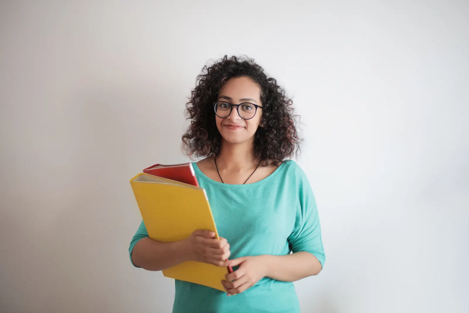 A stock portrait of a member of teaching staff against a plain background. Not a member of this school.