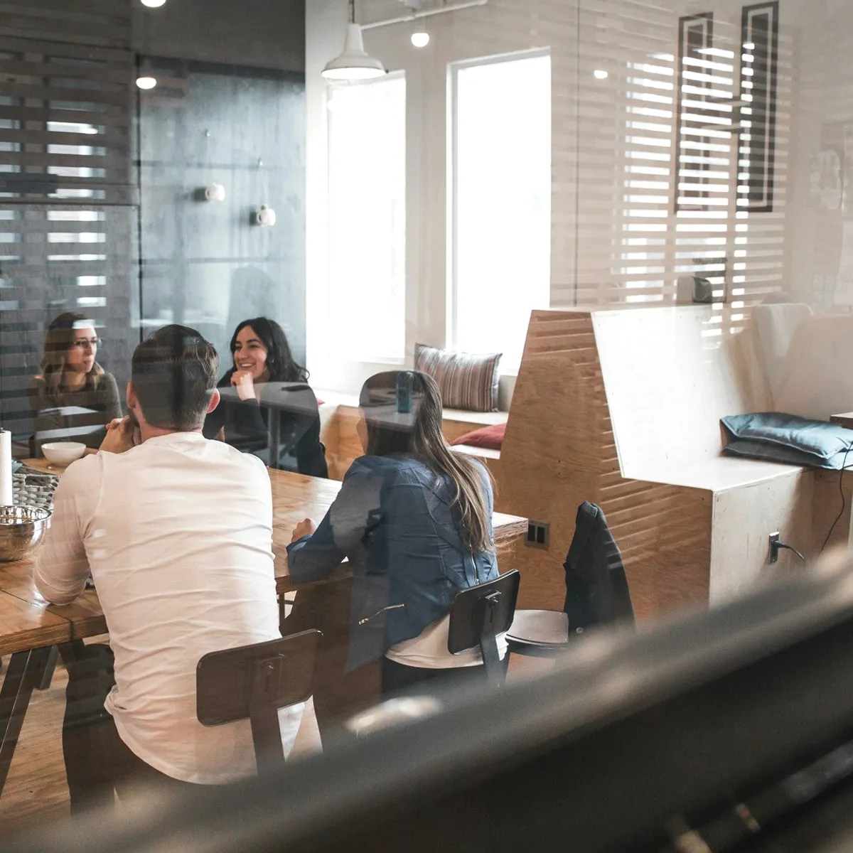 People seated in a bright office.