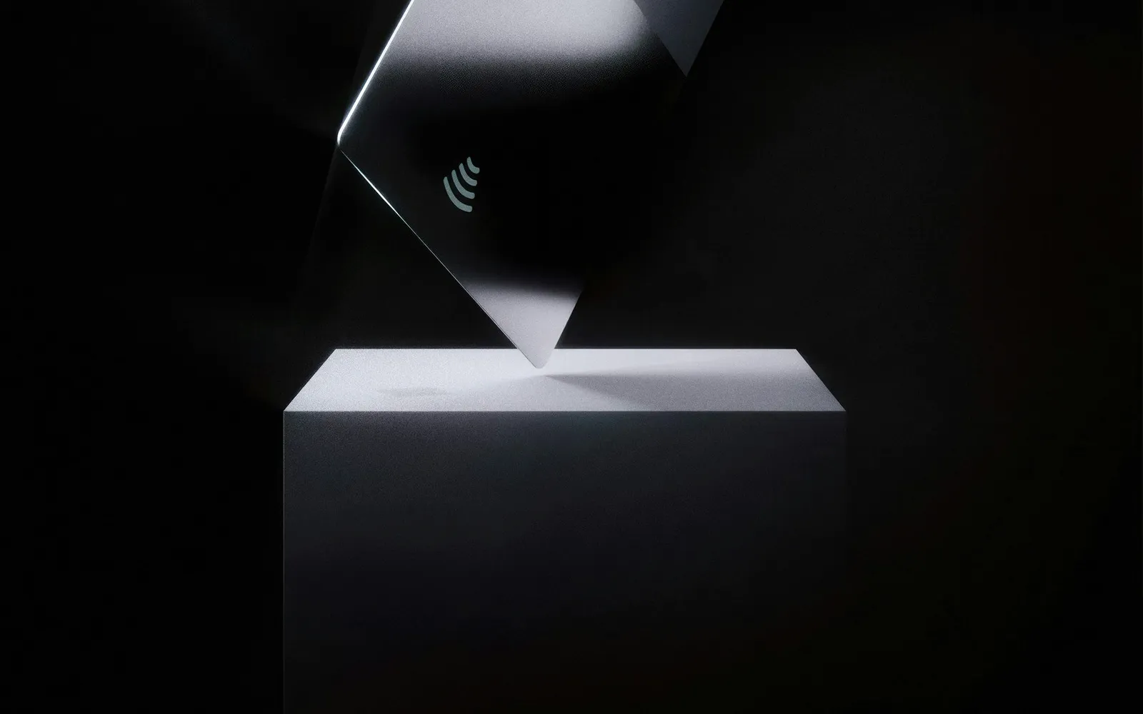 A dark card on a black surface.