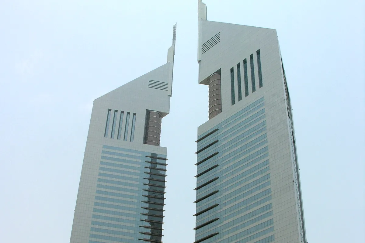 A concrete building under a white sky.