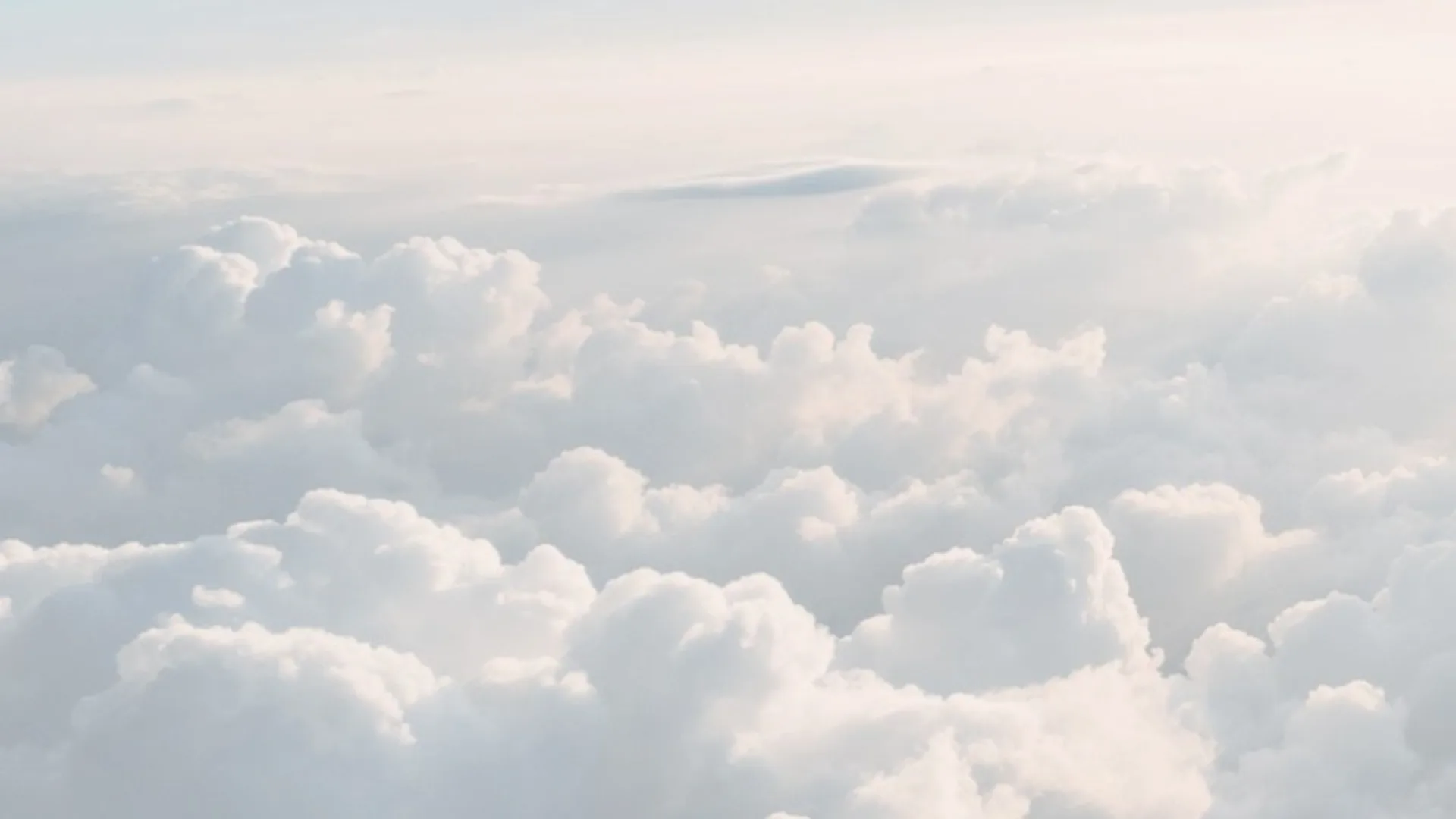 A bright sky over a sea of clouds.