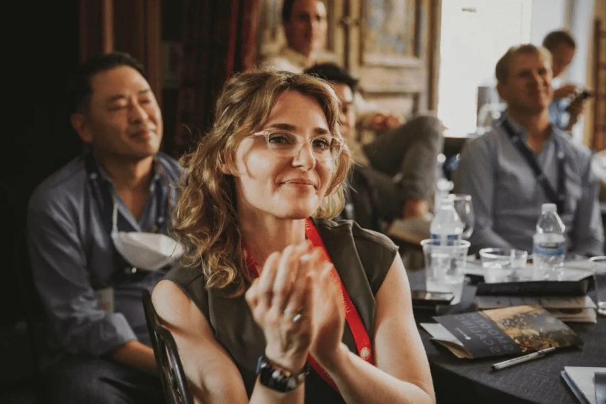 An audience member applauding.