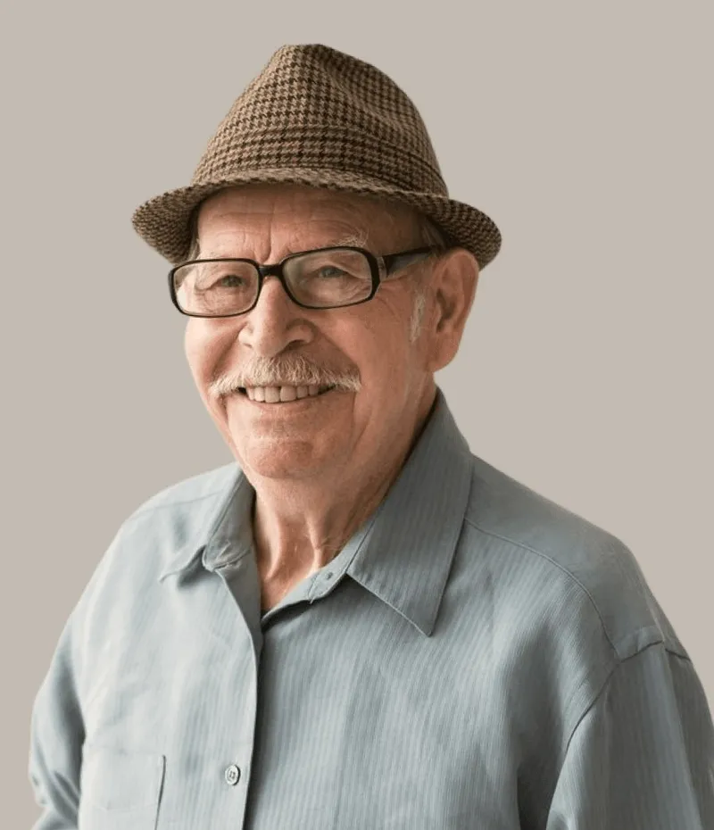 A man in a hat and glasses.