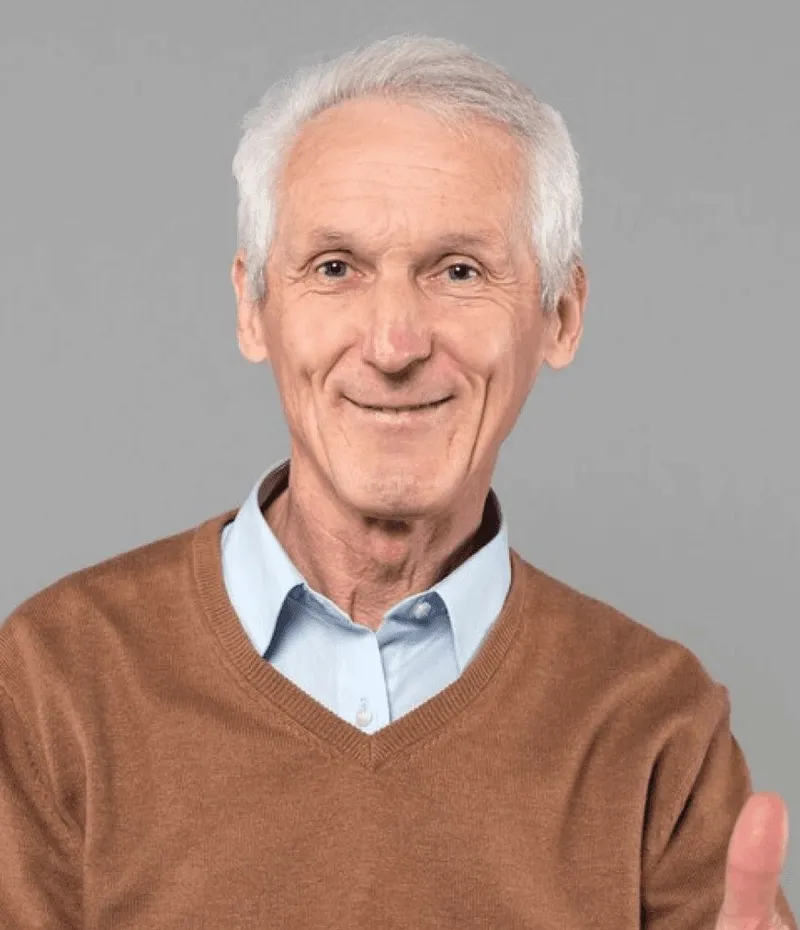 A man in a brown cardigan.