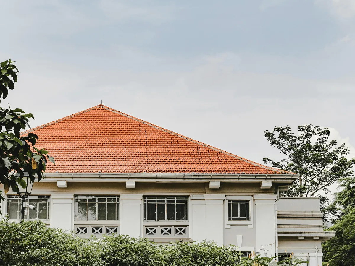 A house with an orange tiled roof.