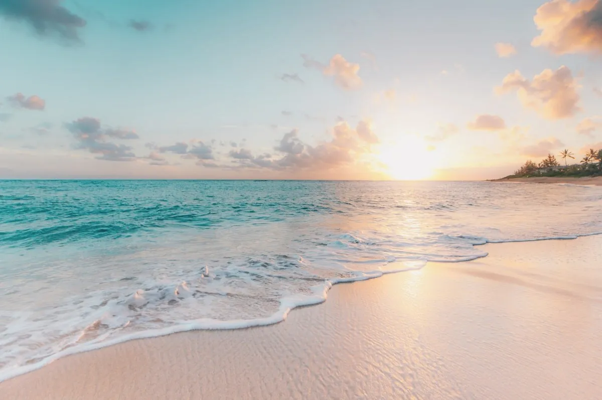A beach at sunset, the tide going out.