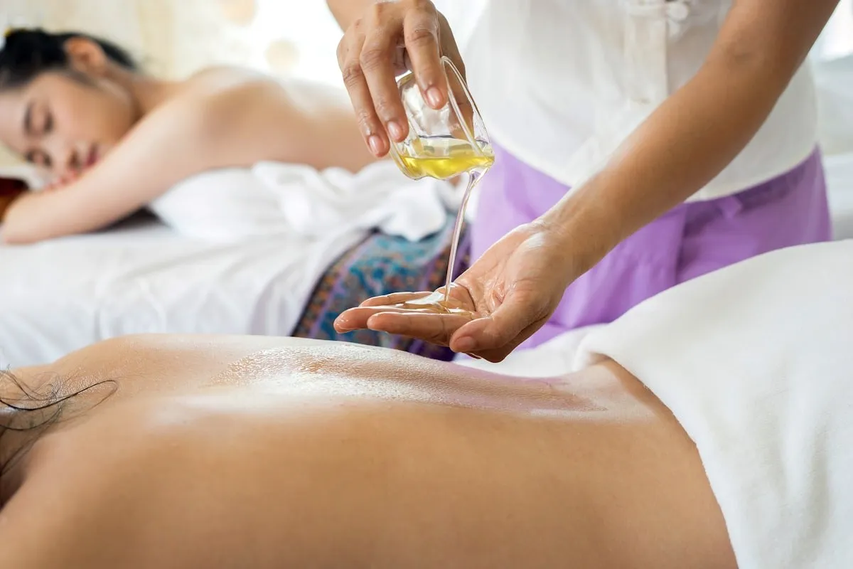 Oil being poured during a massage.
