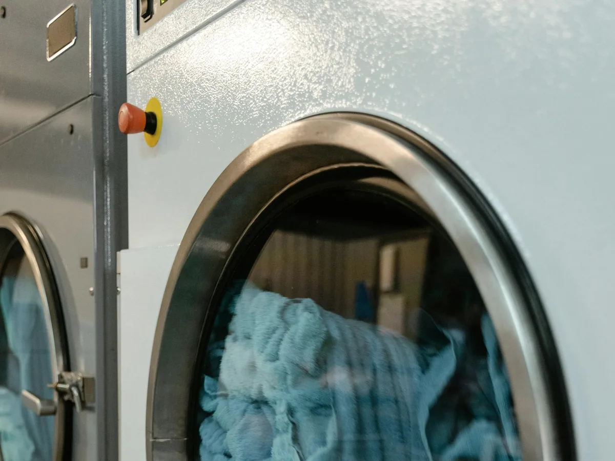 Blue towels in a dryer drum.