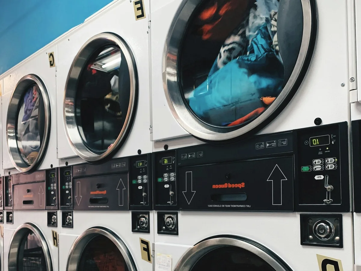 Washing machines in a laundrette.