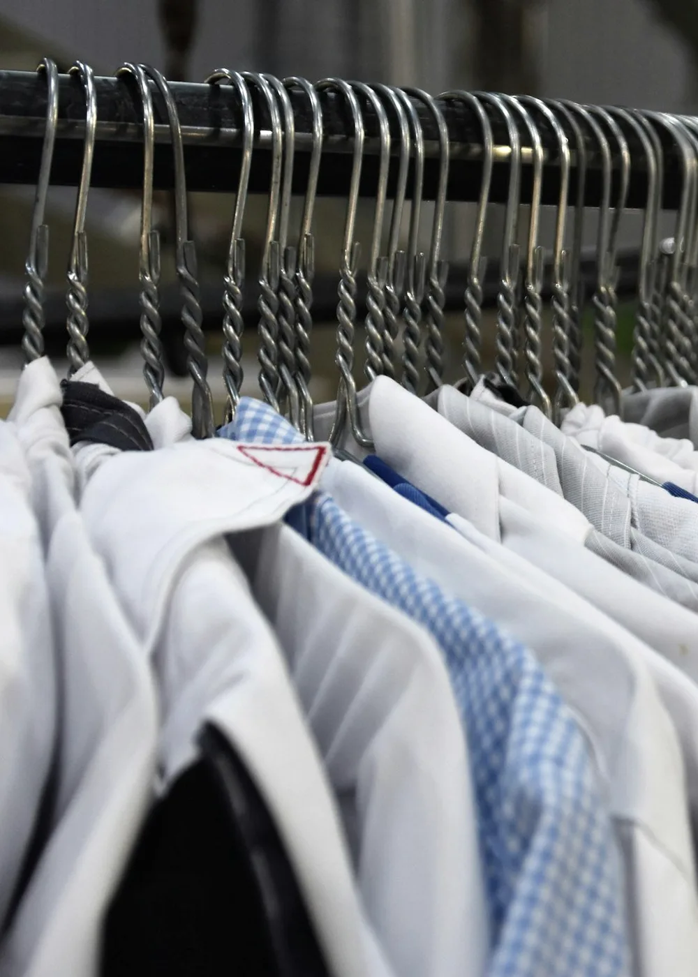 White shirts on wire hangers.